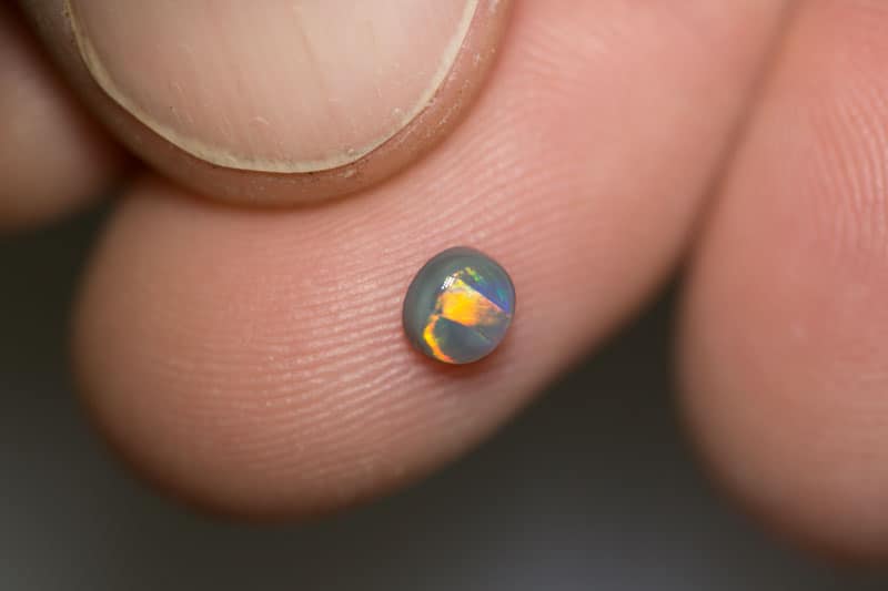 0.38 ct black opal 4.5x4x2mm