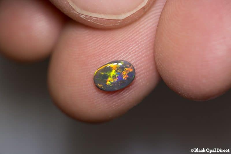 0.39 ct dark opal 6.8x4.8x1.8mm