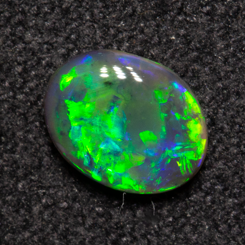0.40 ct black opal 6.1x4.7x2.1mm
