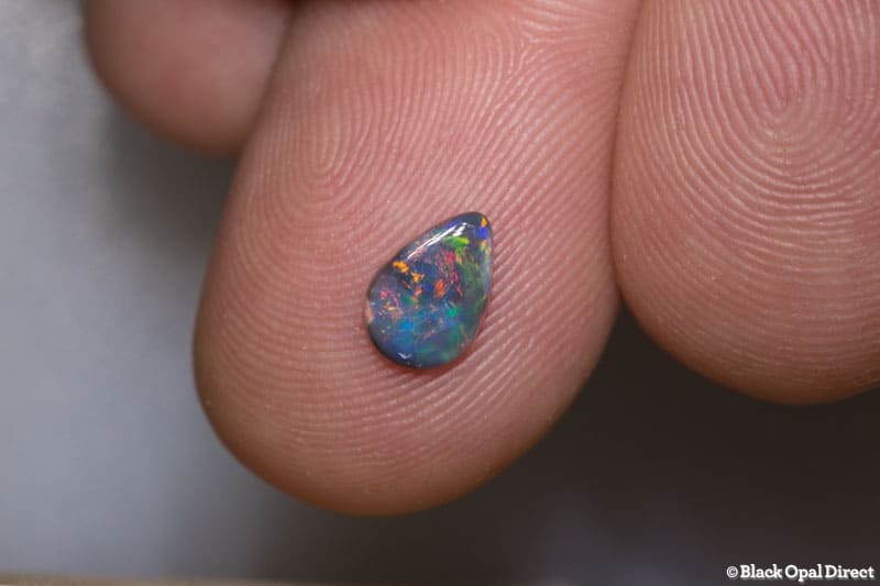 0.40 ct drop shaped black opal 7x5x1mm