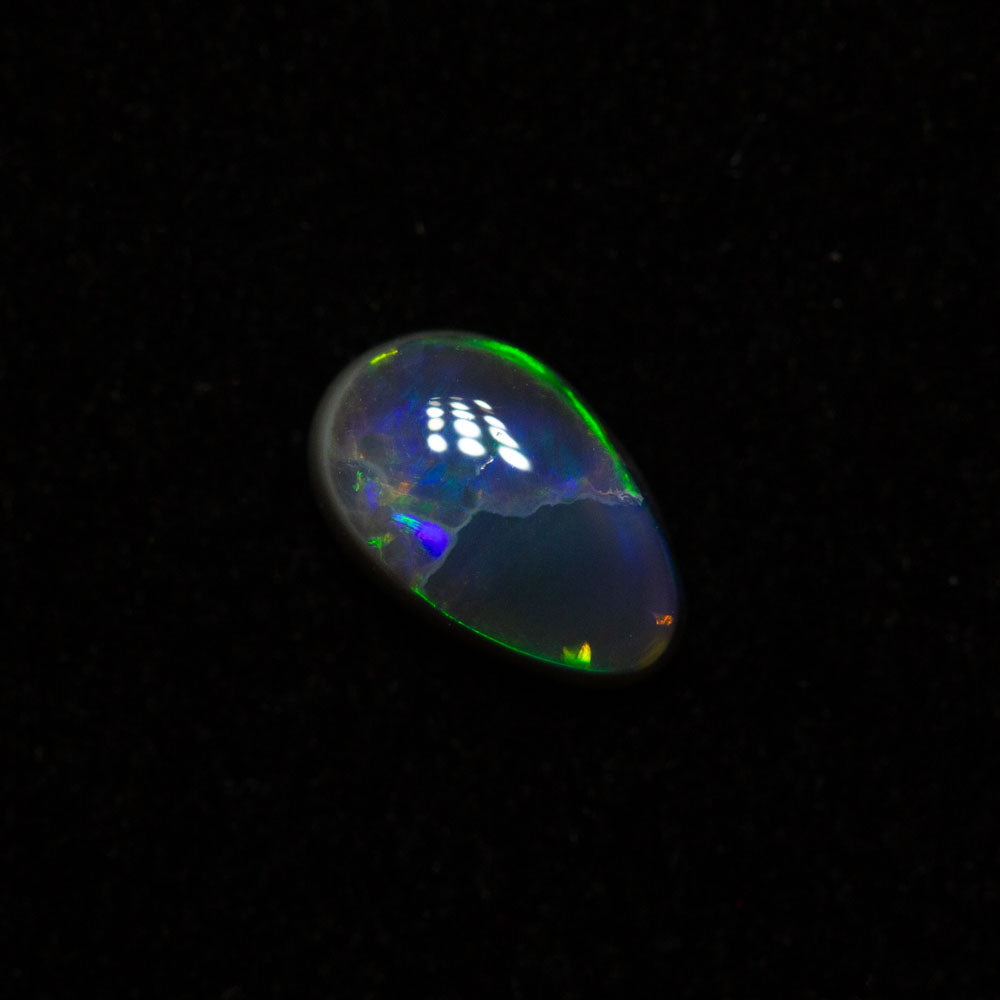 0.42 ct black opal 6.4x4.1x2.5mm