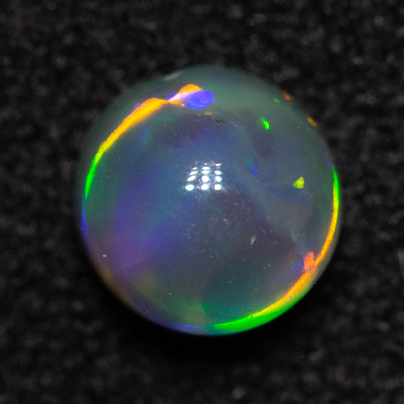 0.47 ct dark opal 4.7x4.6x3.2mm