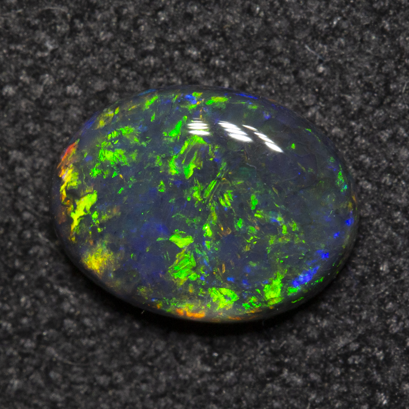 0.49 ct black opal 6.7x5.1x2mm