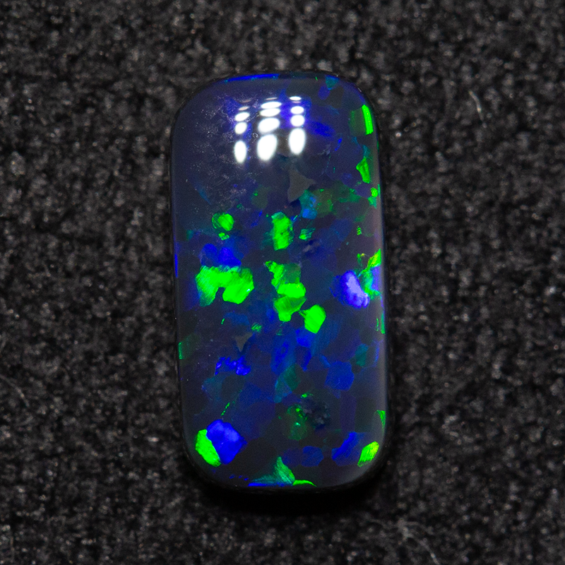 0.49 ct black opal 7.1x3.6x2.1mm