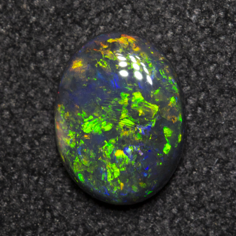 0.49 ct black opal 6.7x5.1x2mm