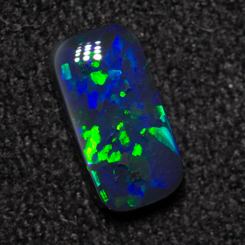 0.49 ct black opal 7.1x3.6x2.1mm