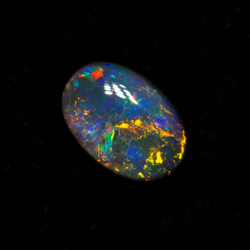 0.49 ct black opal 6.4x4.3x2.6mm