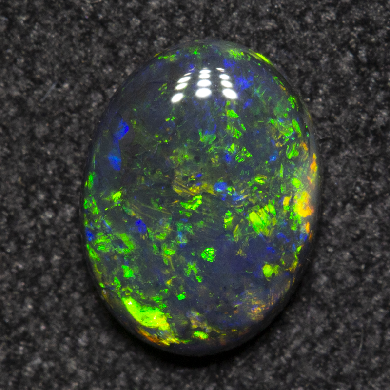 0.49 ct black opal 6.7x5.1x2mm