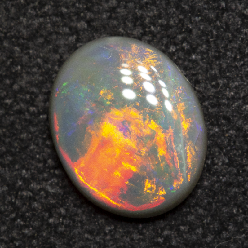 0.50 ct dark opal 6.7x5.4x1.9mm