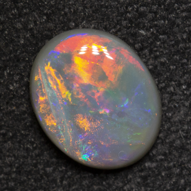 0.50 ct dark opal 6.7x5.4x1.9mm