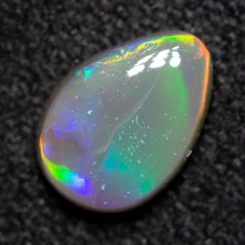 0.51 ct dark opal 6.7x4.8x2.4mm