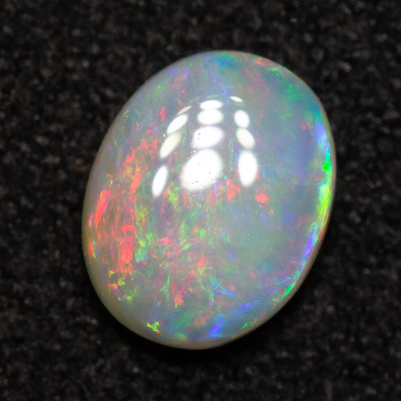 0.52 ct white opal 6.5x5.1x2.4mm