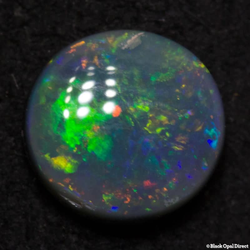 0.52 ct black opal 6mm round x2mm