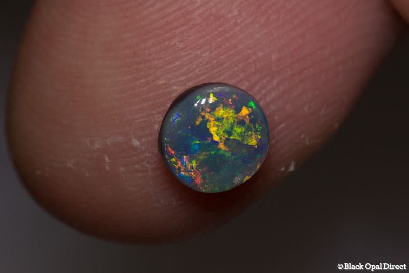0.52 ct black opal 6mm round x2mm