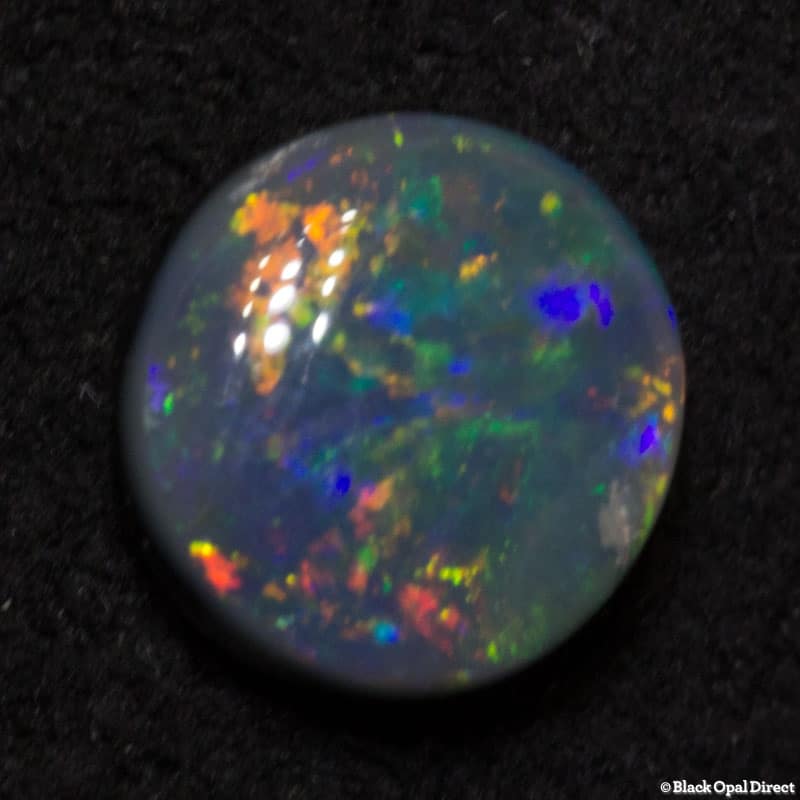 0.52 ct black opal 6mm round x2mm