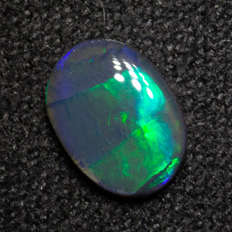 0.53 ct black opal 7.2x5.3x2mm