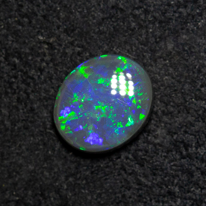 0.53 ct black opal 6.4x5.5x2.4mm