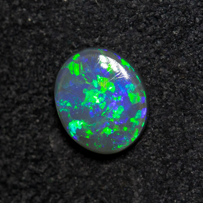 0.53 ct black opal 6.4x5.5x2.4mm