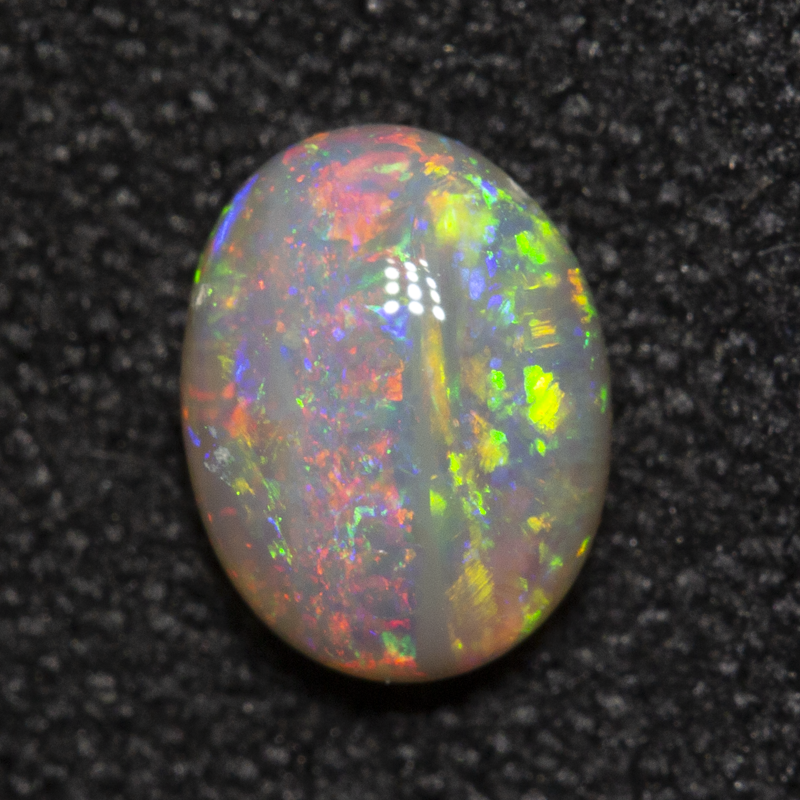 0.53 ct dark opal 6.1x4.7x2.7mm