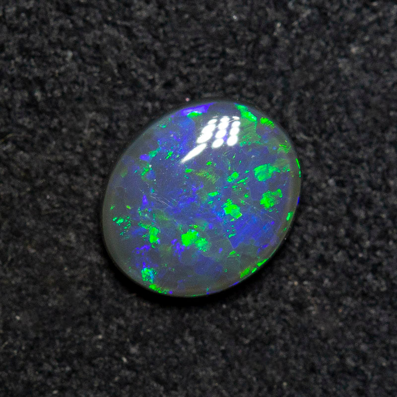 0.53 ct black opal 6.4x5.5x2.4mm