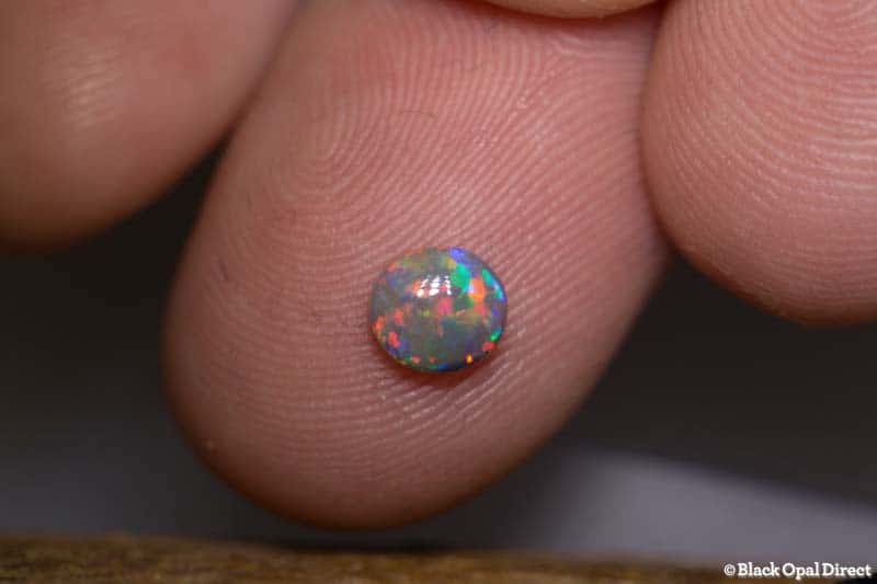 0.53 ct semi black opal 5.6x5x2.5mm