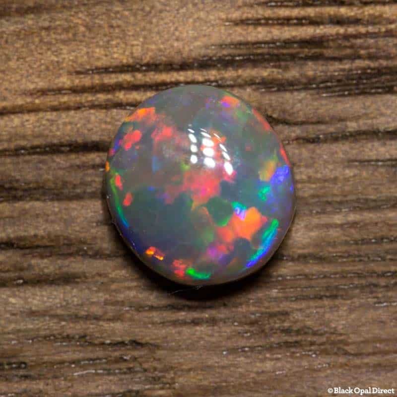 0.53 ct semi black opal 5.6x5x2.5mm