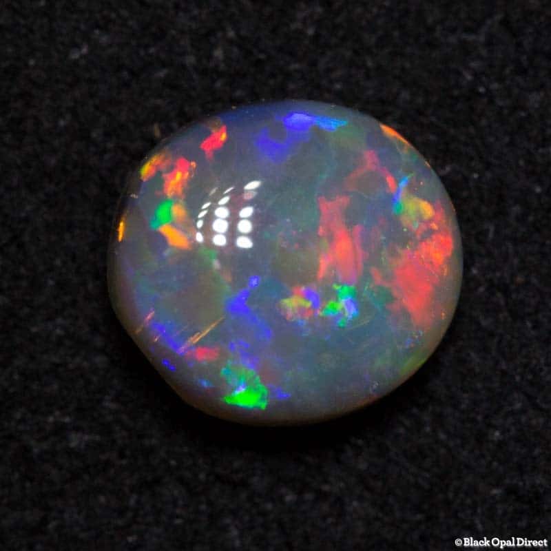 0.53 ct semi black opal 5.6x5x2.5mm