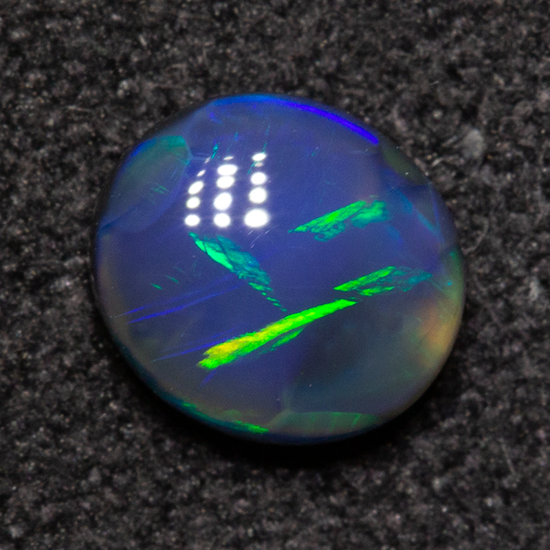 0.54 ct black opal 5.8x5.3x2.5mm