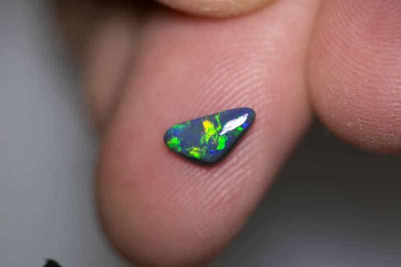 0.54 ct baroque black opal 8.5x4.5x2mm