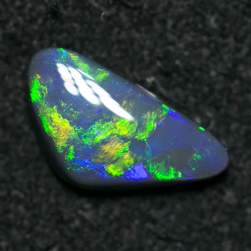 0.54 ct baroque black opal 8.5x4.5x2mm