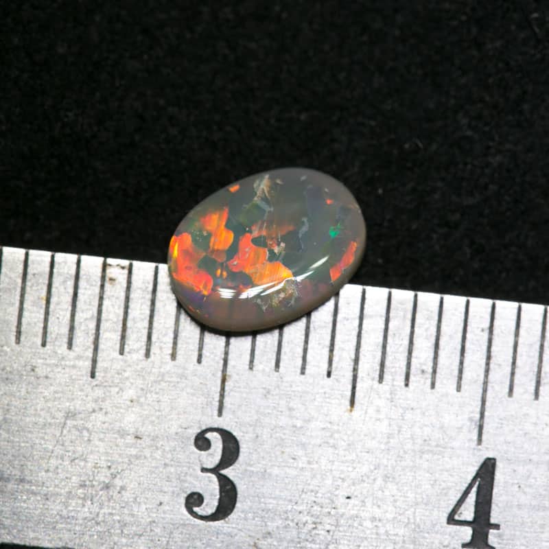 0.54 ct dark opal 7x6x1.5mm