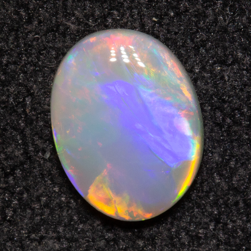 0.55 ct dark opal 7.2x5.6x1.9mm