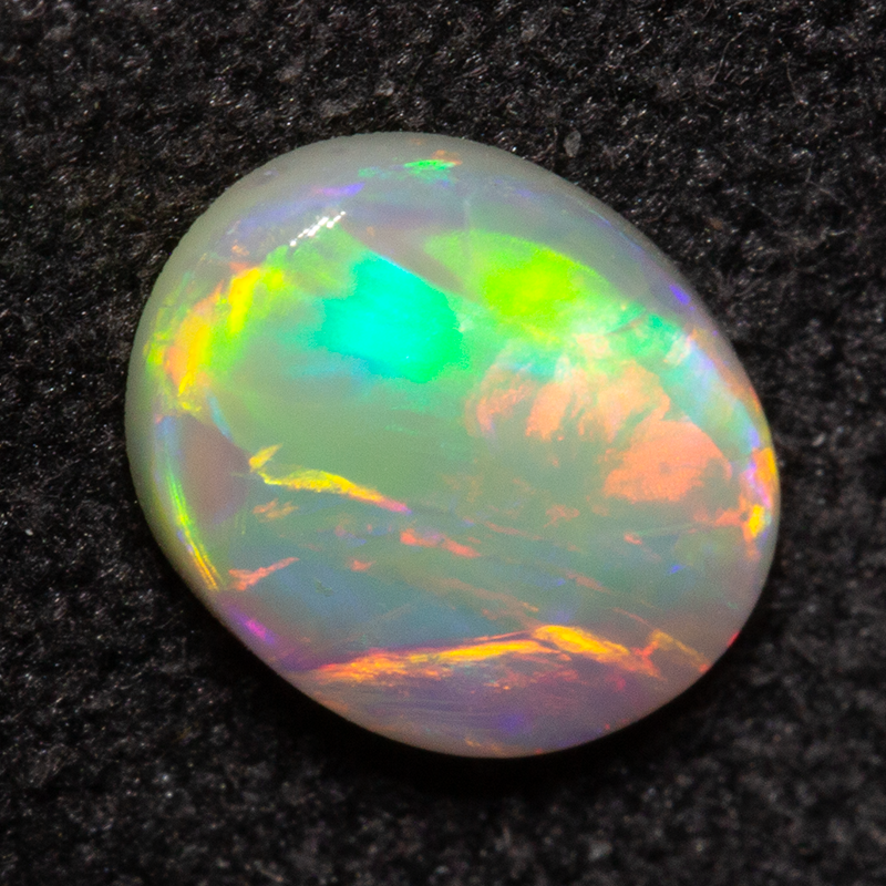 0.55 ct dark opal 7.2x5.6x1.9mm