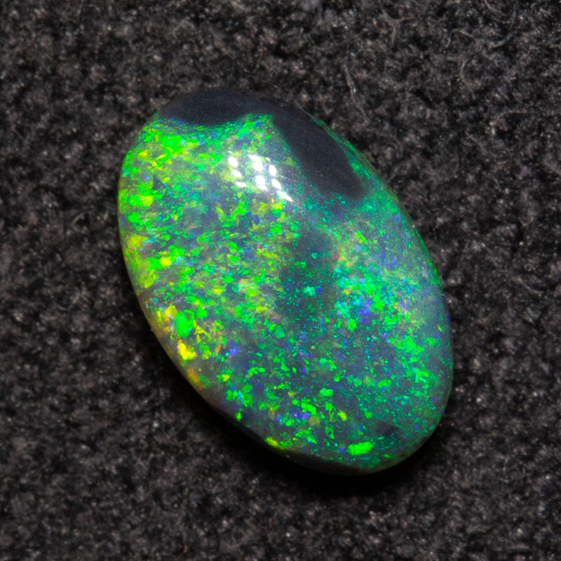 0.56 ct double-sided black opal 6.9x4.5x2.8mm