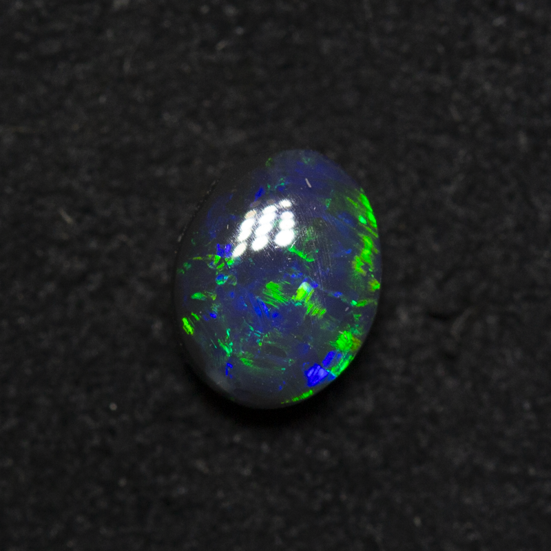 0.57 ct black opal 5.9x4.6x3mm