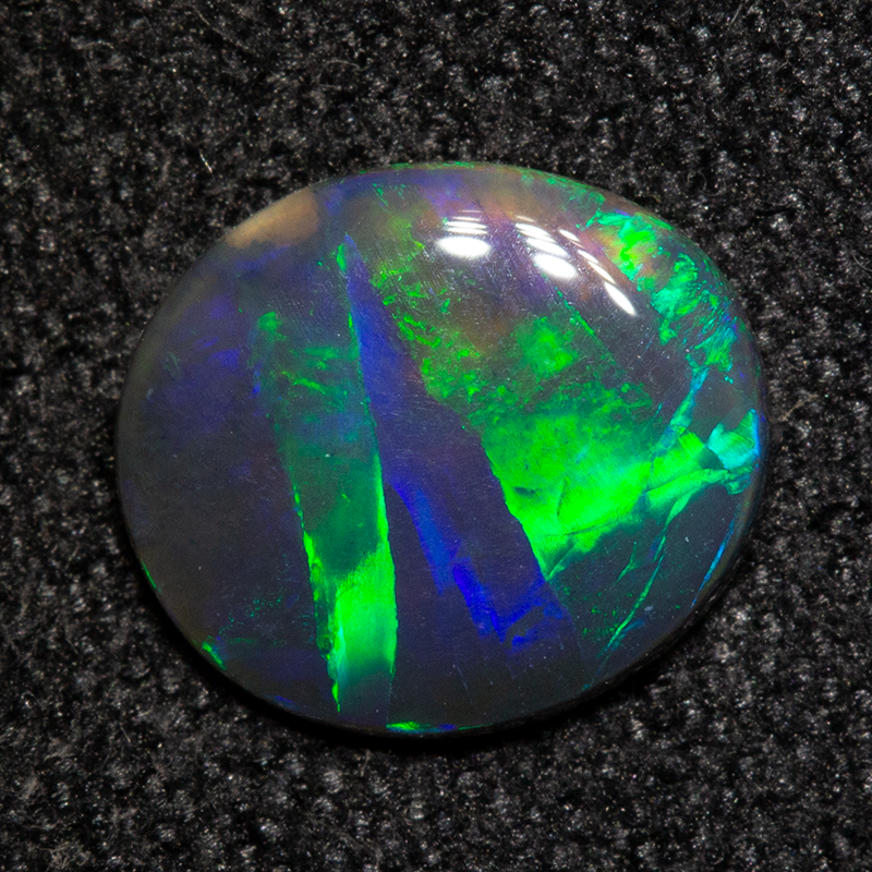 0.58 ct black opal 7.8x6.8x1.5mm