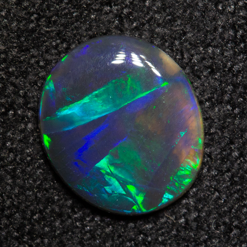 0.58 ct black opal 7.8x6.8x1.5mm