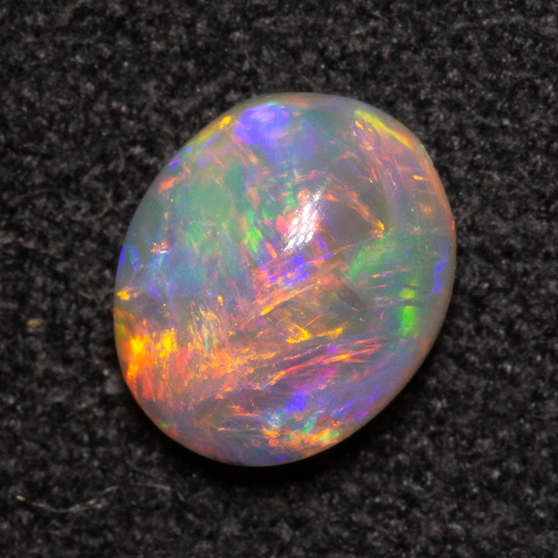 0.58 ct dark opal 6.4x5.4x3mm