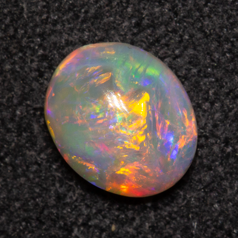 0.58 ct dark opal 6.4x5.4x3mm