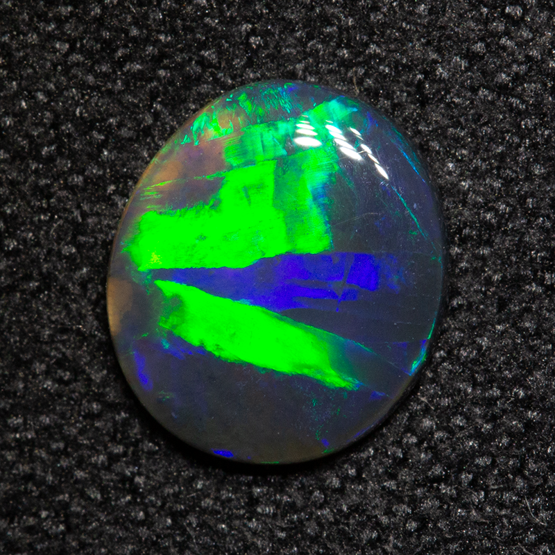 0.58 ct black opal 7.8x6.8x1.5mm