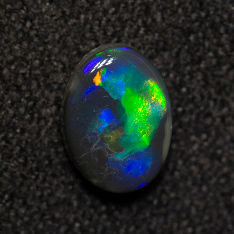 0.59 ct black opal 6.6x4.9x2.6mm
