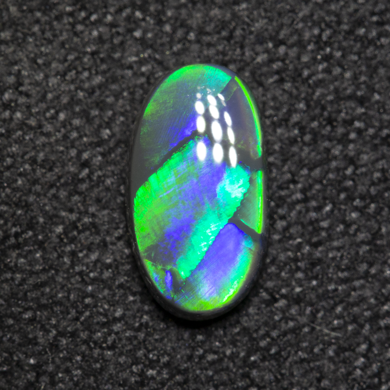 0.59 ct black opal 7.8x4.4x2.6mm