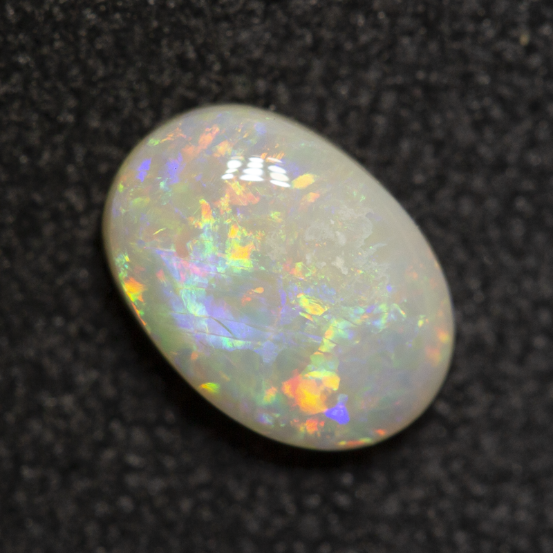 0.59 ct white opal 6.8x4.8x2.5mm