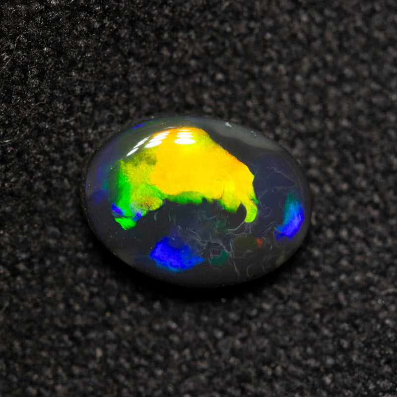 0.59 ct black opal 6.6x4.9x2.6mm