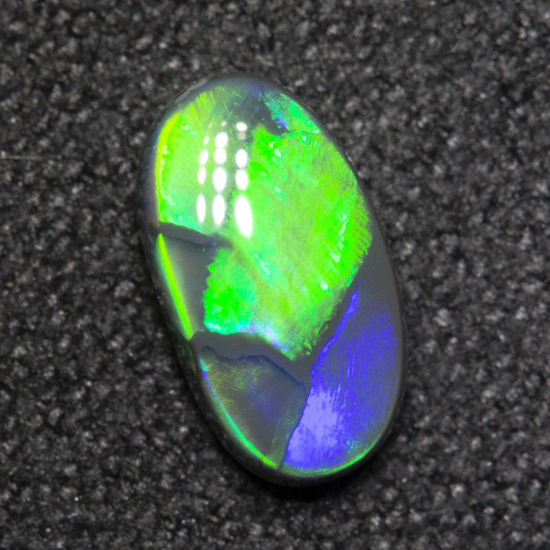 0.59 ct black opal 7.8x4.4x2.6mm