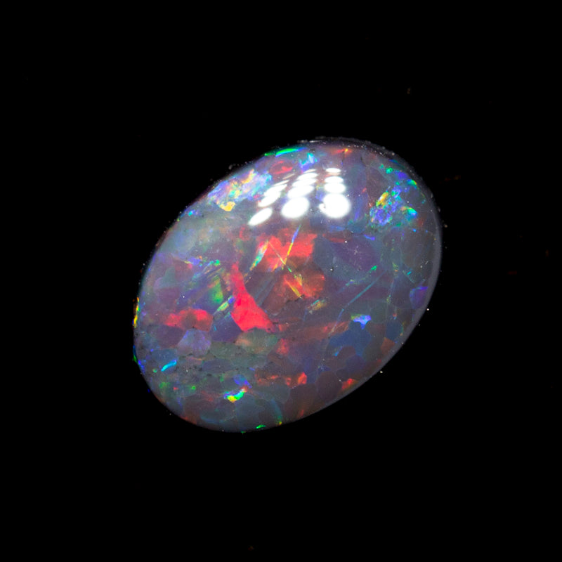 0.59 ct black opal 6.8x5.1x2.4mm