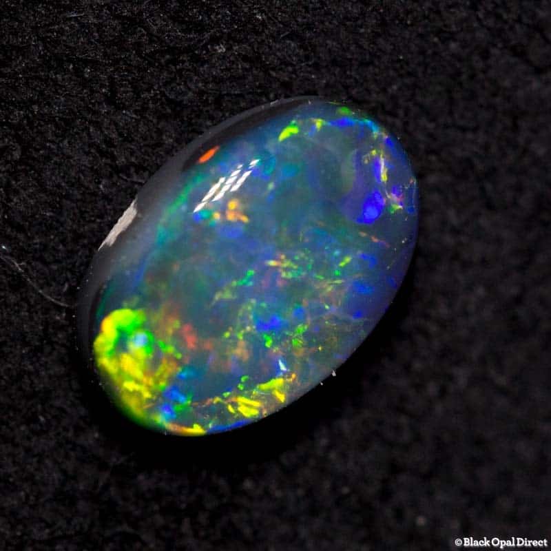 0.59 ct black opal 7x4.5x2mm