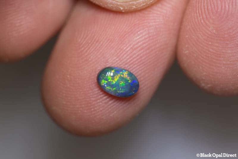 0.59 ct black opal 7x4.5x2mm