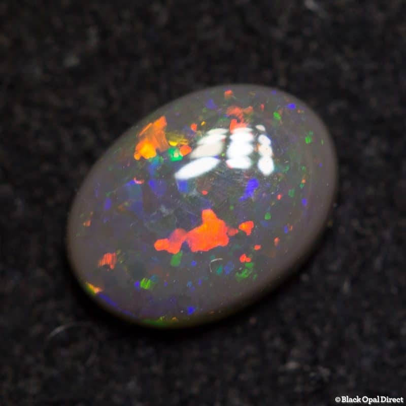 0.59 ct semi black opal 6.5x4.5x2mm