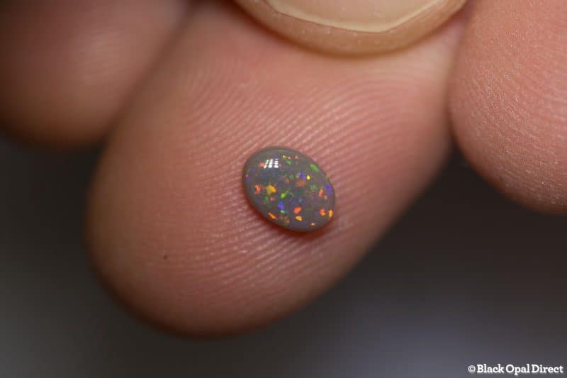 0.59 ct semi black opal 6.5x4.5x2mm